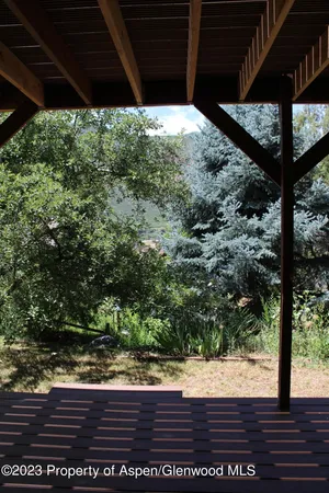 a view of a backyard of the house
