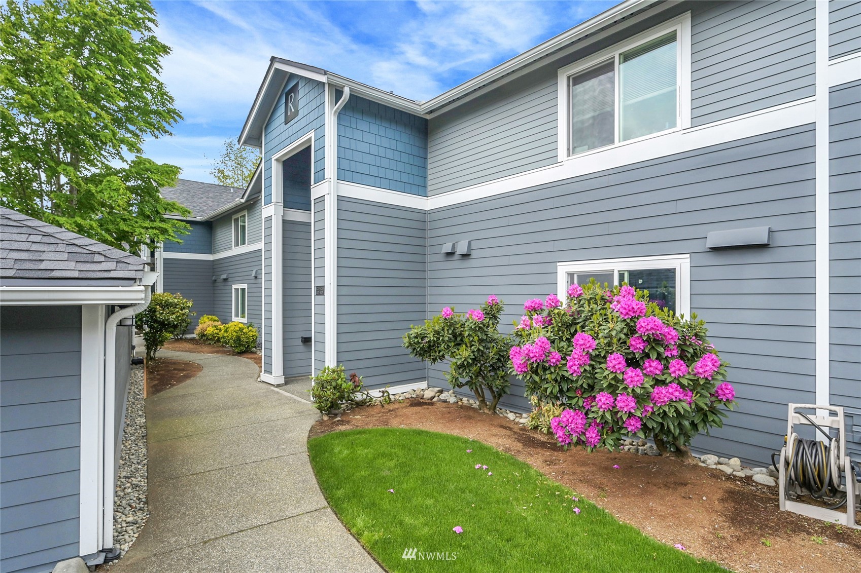 2201 192nd Street Southeast, Unit R103 Bothell, WA 98012 - Photo 1 of 29 a house view with a seating space