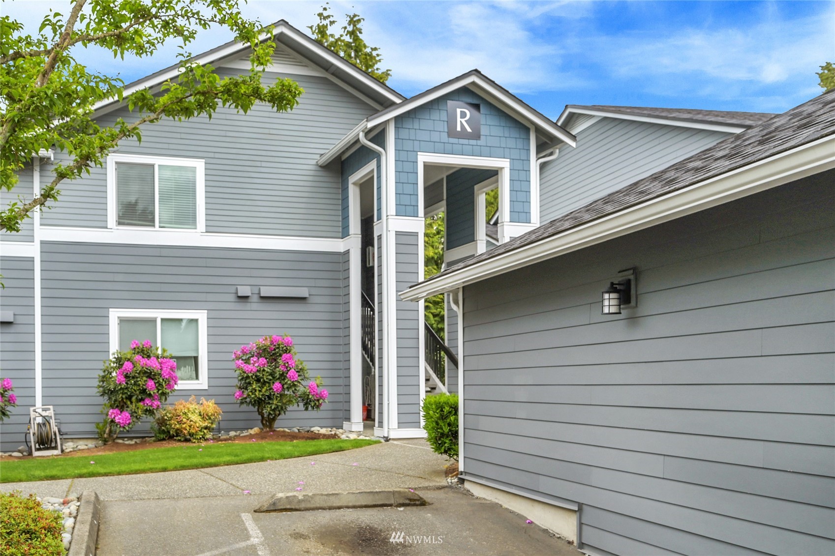 2201 192nd Street Southeast, Unit R103 Bothell, WA 98012 - Photo 28 of 29 a front view of a house with a yard