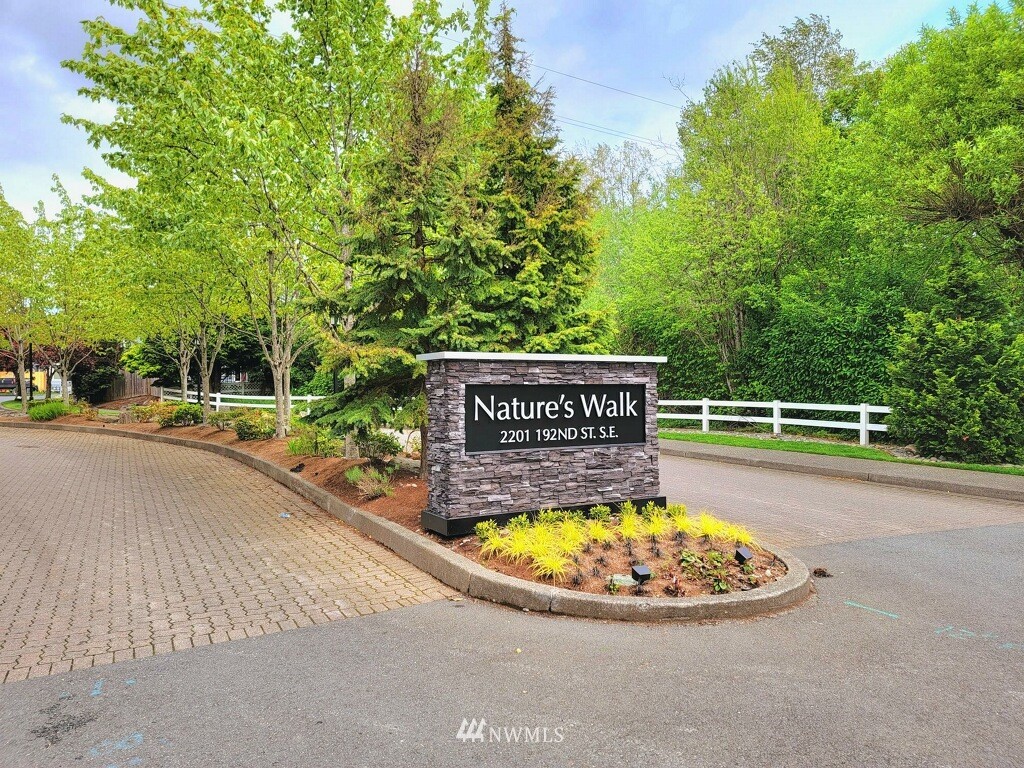 2201 192nd Street Southeast, Unit R103 Bothell, WA 98012 - Photo 29 of 29 a view of swimming pool with a garden
