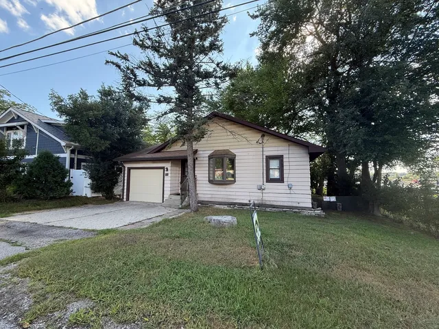 a front view of a house with yard