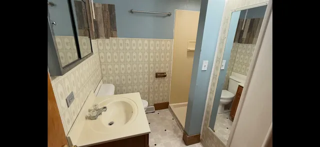 a bathroom with a sink and a shower