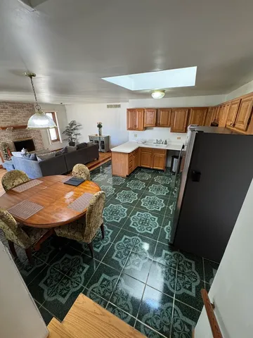 a outdoor space with a table and chairs