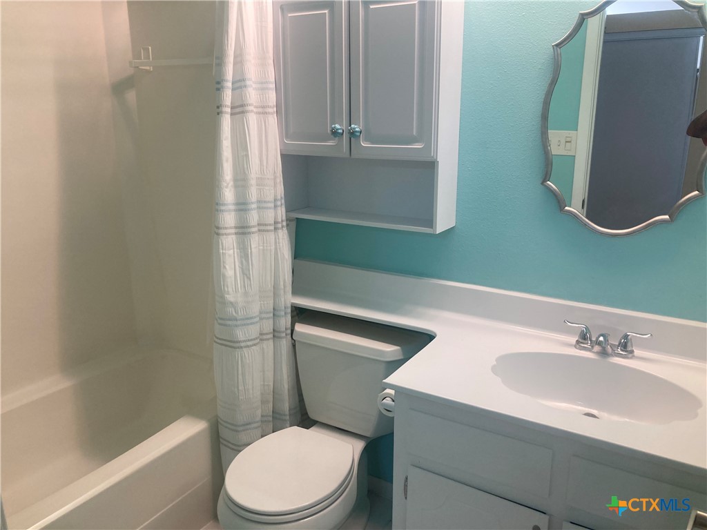 406 Rattan Drive Victoria, TX 77901 - Photo 10 of 15 a bathroom with a sink a toilet and shower