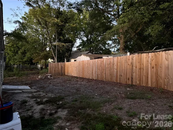 a view of backyard with tree