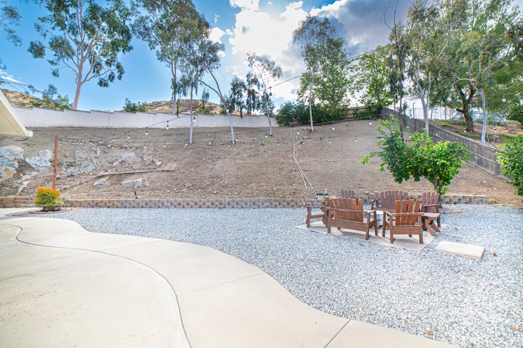 17801 Morning Rock Circle Riverside, CA 92503 - Photo 16 of 18 a backyard of a house with table and chairs