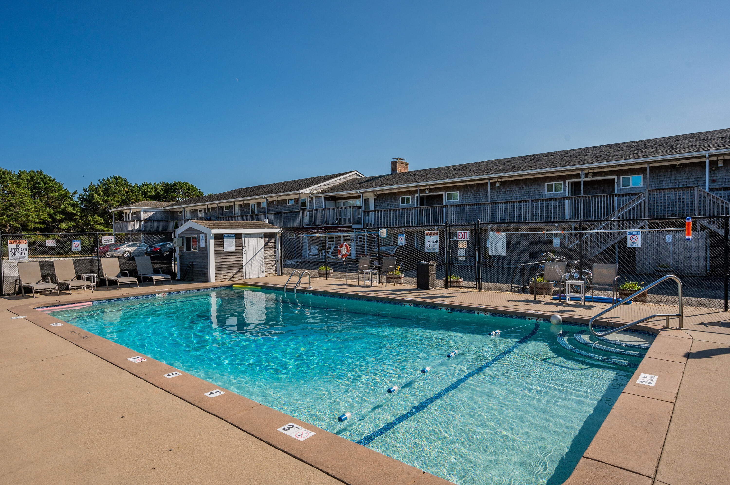 132 Shore Road, Unit 7 Truro, MA 02666 - Photo 23 of 24 a view of a house with swimming pool and porch