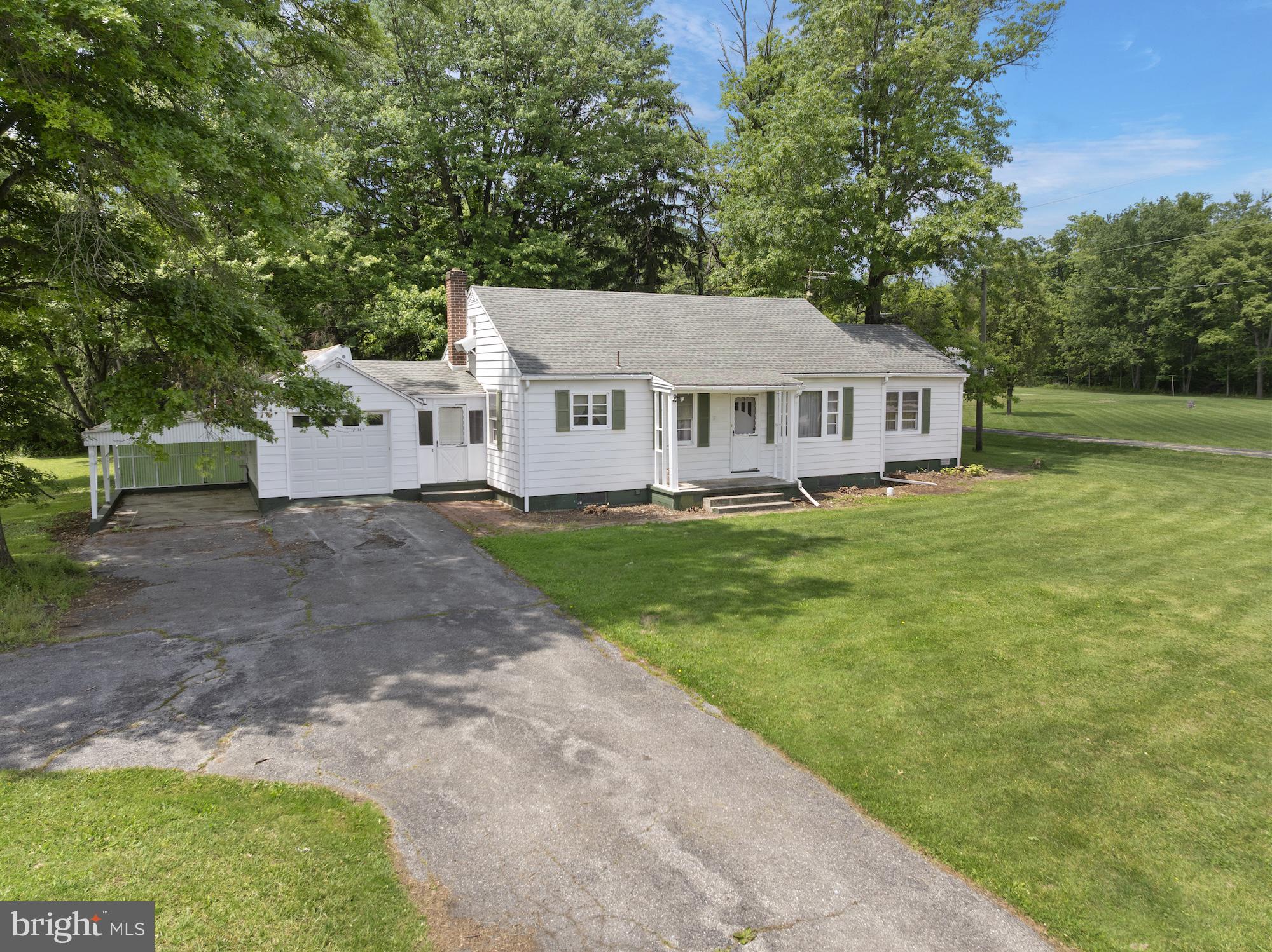 1454 Granite Station Road Gettysburg, PA 17325 - Photo 1 of 1 a view of a house with a big yard plants and large trees