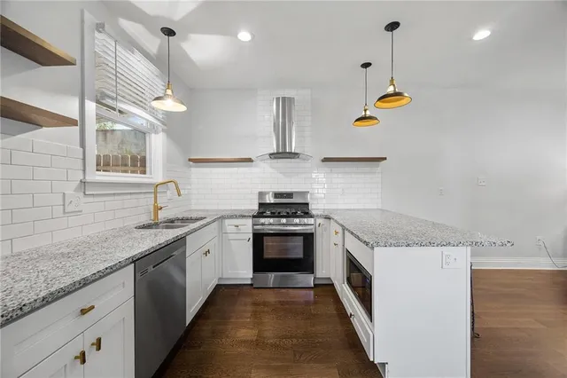 a kitchen with a stove and a sink