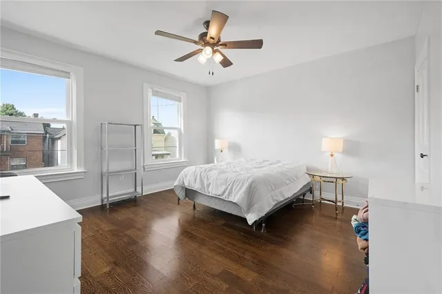 a bedroom with a bed and a view of kitchen