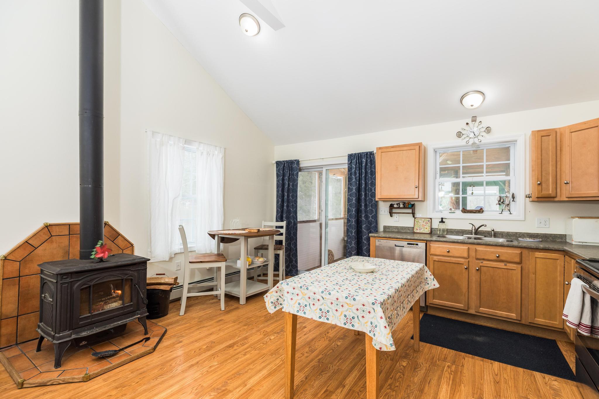 8 Hedgebog Mountain Road Naples, ME 04055 - Photo 11 of 33 eat in kitchen w wood stove