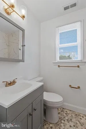 a bedroom with bed and a window