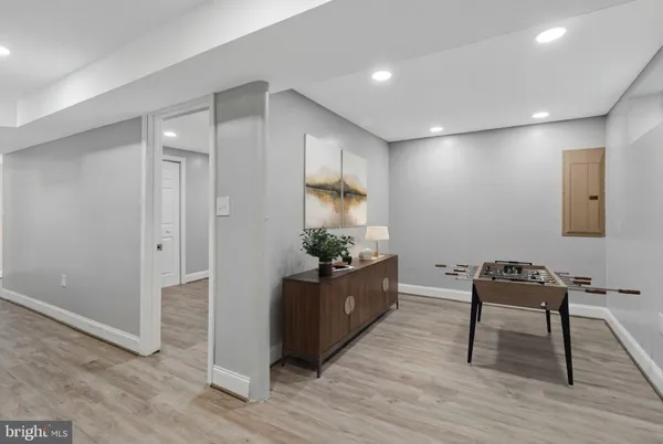a bedroom with a bed and a mirror