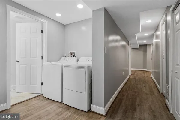 a bathroom with a toilet a sink and a mirror
