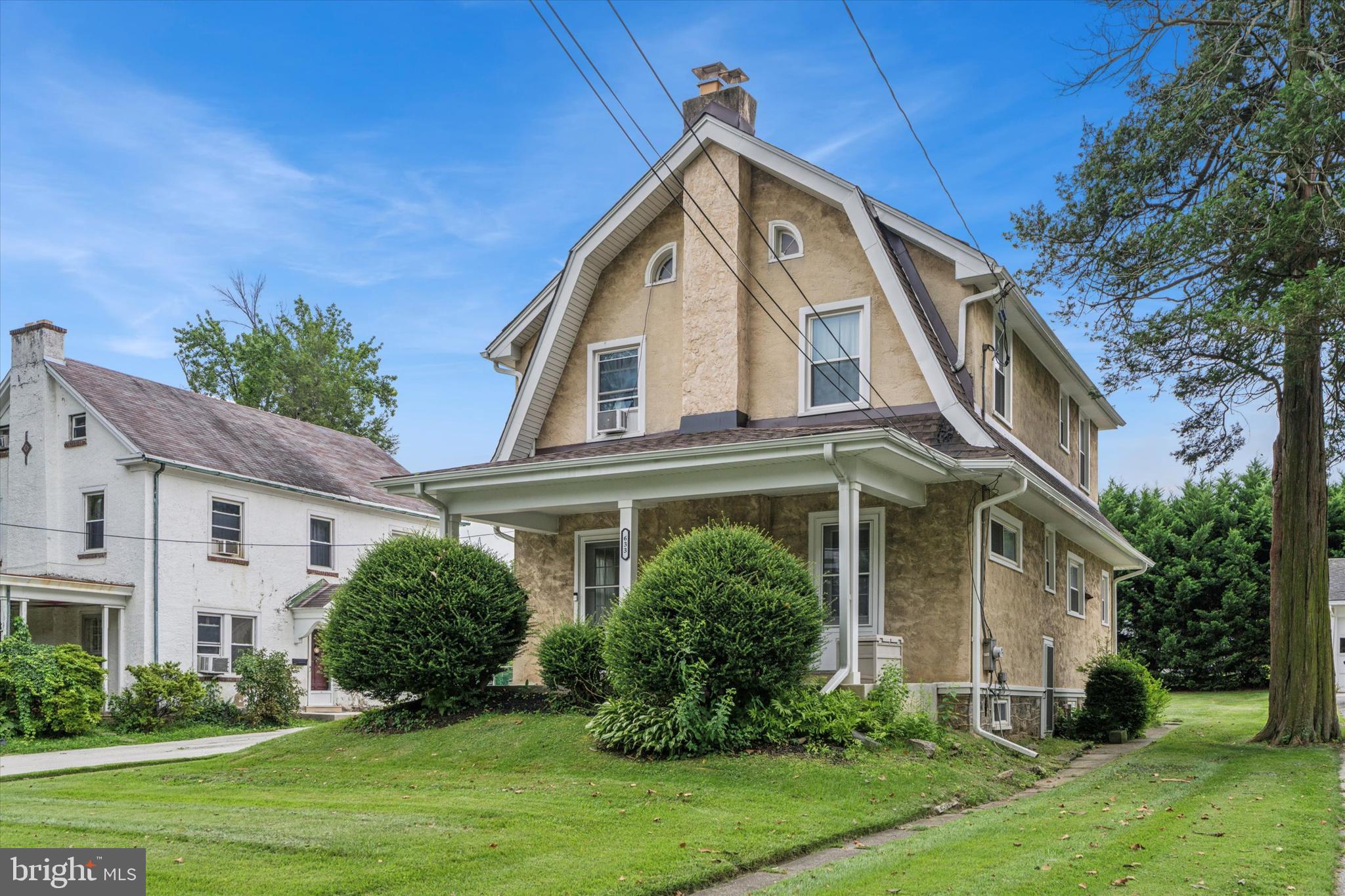 633 East Manoa Road Havertown, PA 19083 - Photo 3 of 25 a front view of a house with a yard