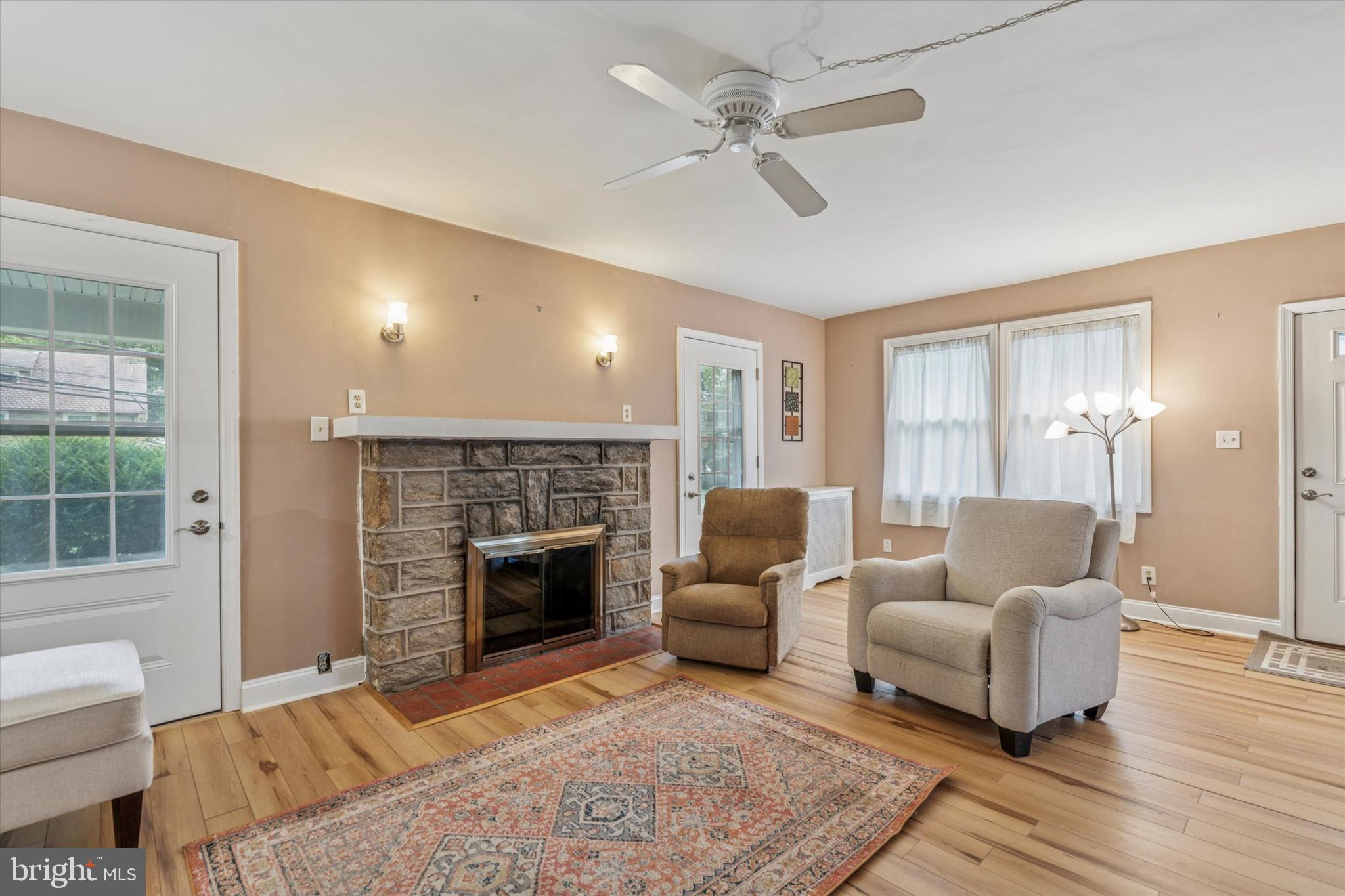 633 East Manoa Road Havertown, PA 19083 - Photo 10 of 25 a living room with furniture and a fireplace