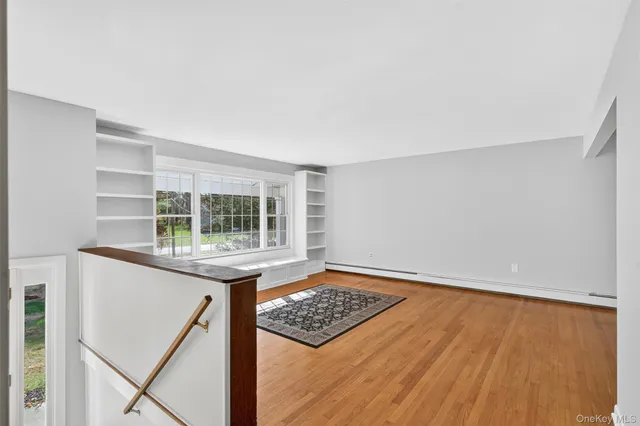 a living room with furniture rug and window