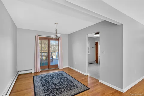 a kitchen with stainless steel appliances granite countertop a refrigerator a stove a sink and a cabinets