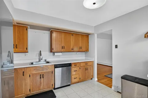 a view of a room with wooden floor and white walls