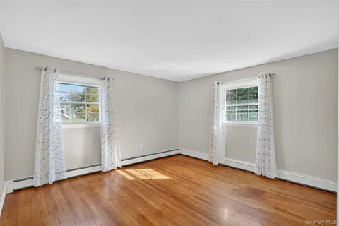 a view of entryway with wooden floor and door