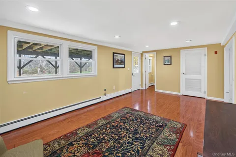 a room with furniture and wooden floor