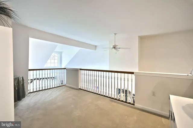 a view of a hallway with windows