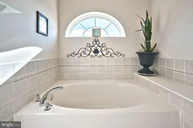 a bathroom with a shower and a sink