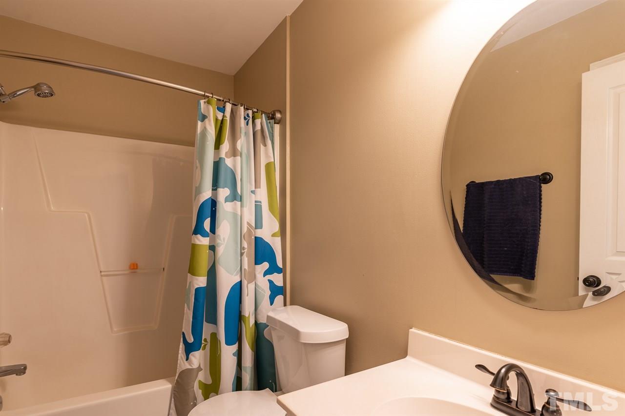1025 Transom Court Raleigh, NC 27603 - Photo 21 of 30 Situated adjacent to the loft and between the two upstairs bedrooms.
