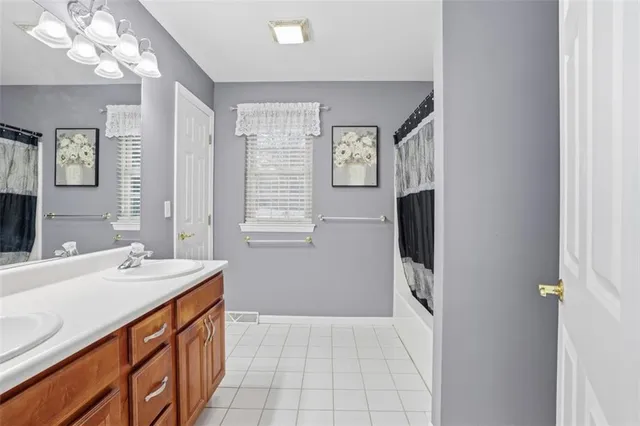 a bathroom with a sink a vanity and a mirror