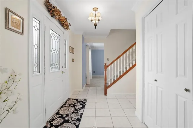 a view of a hallway with entryway door