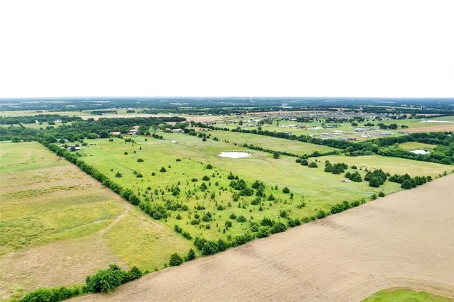 a view of an ocean and a yard