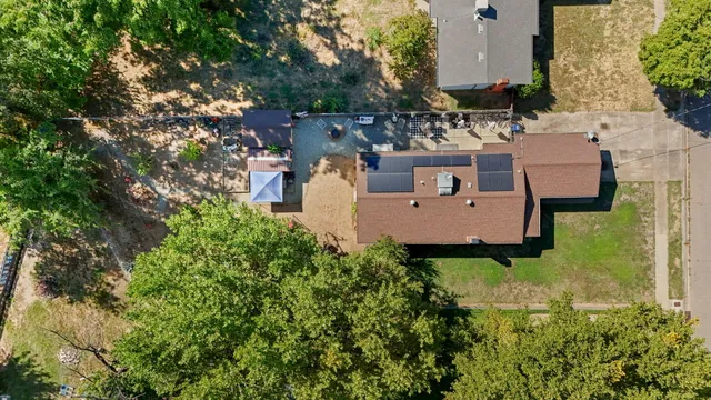 an aerial view of a house with a garden