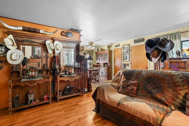 a living room with furniture and a lamp