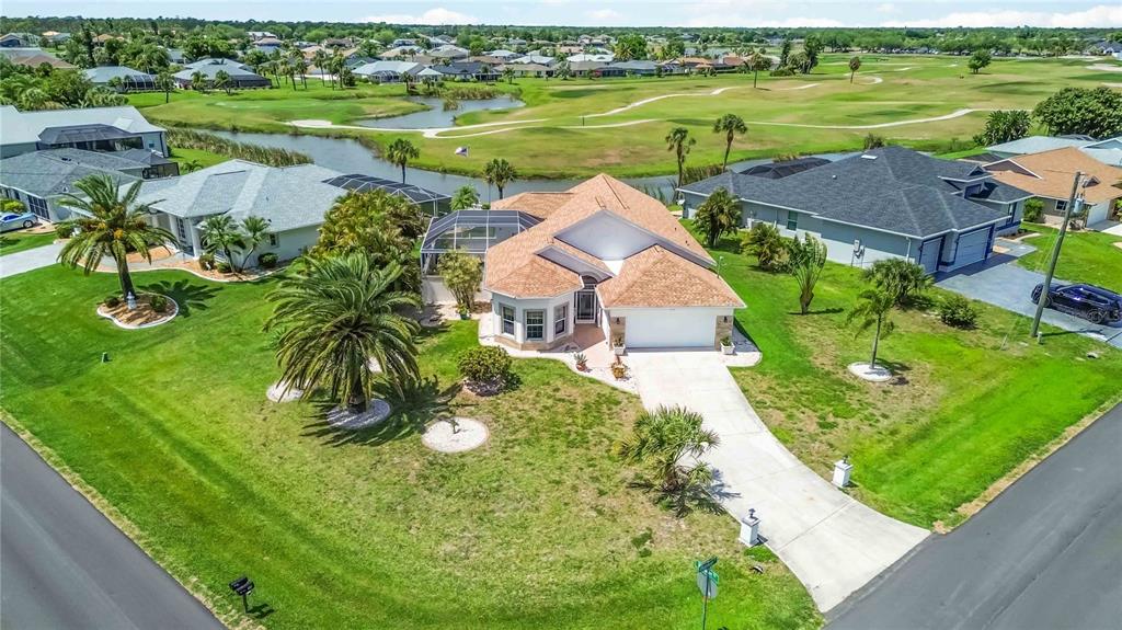 48 Bunker Road Rotonda West, FL 33947 - Photo 1 of 59 an aerial view of a houses with outdoor space and lake view