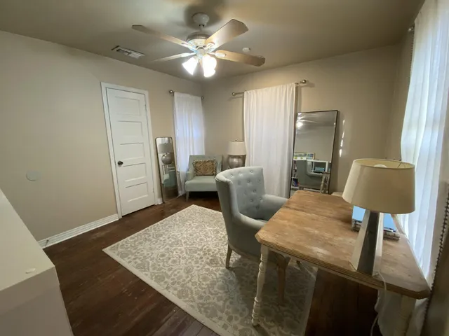 a view of kitchen with cabinets and wooden floor