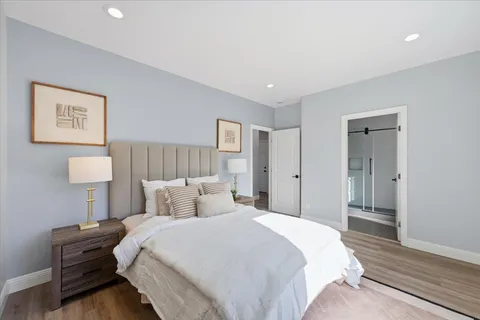 a bedroom with bed and window