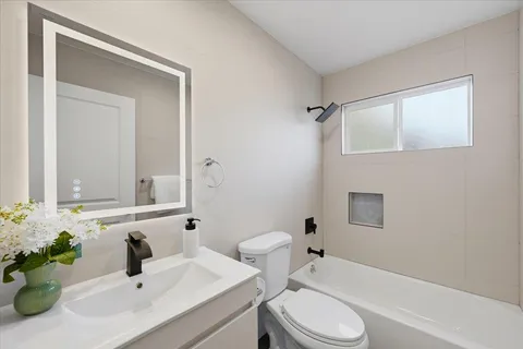 a bedroom with bed and a night stand
