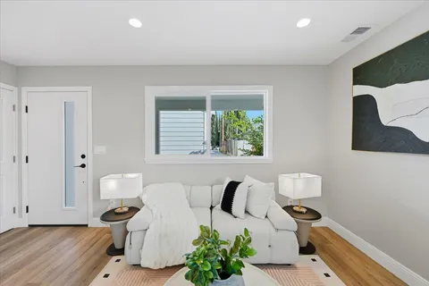 a living room with furniture and a window