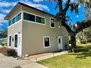 16909 Franklin Avenue, Unit B Montverde, FL 34756 - Photo 3 of 13 a front view of a house with a yard