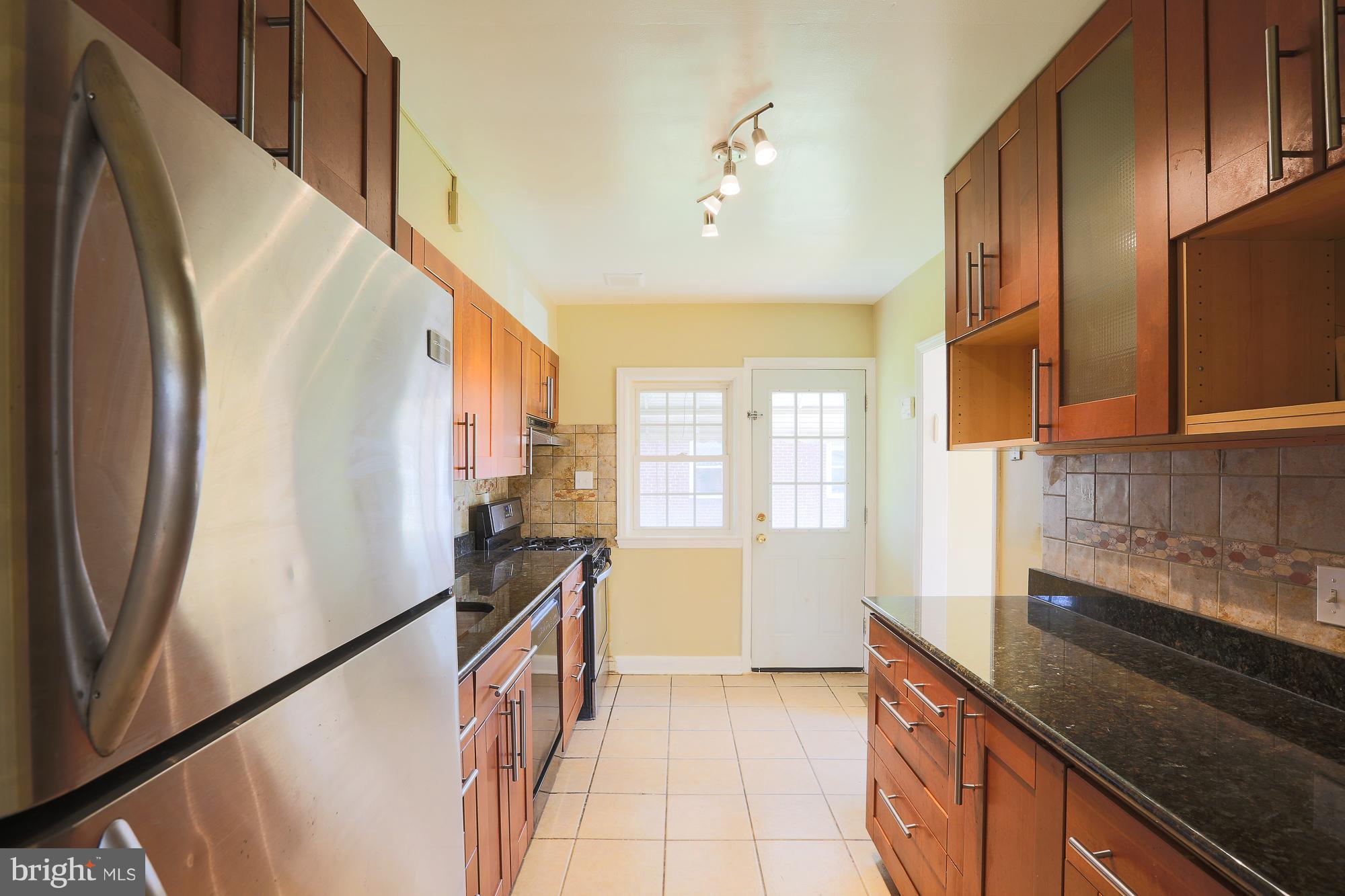 3212 Shelburne Road Baltimore, MD 21208 - Photo 9 of 25 Updated kitchen with stainless steel frig