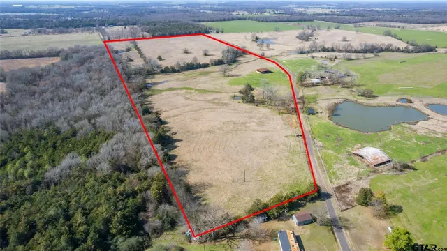 a view of a swimming pool with a yard