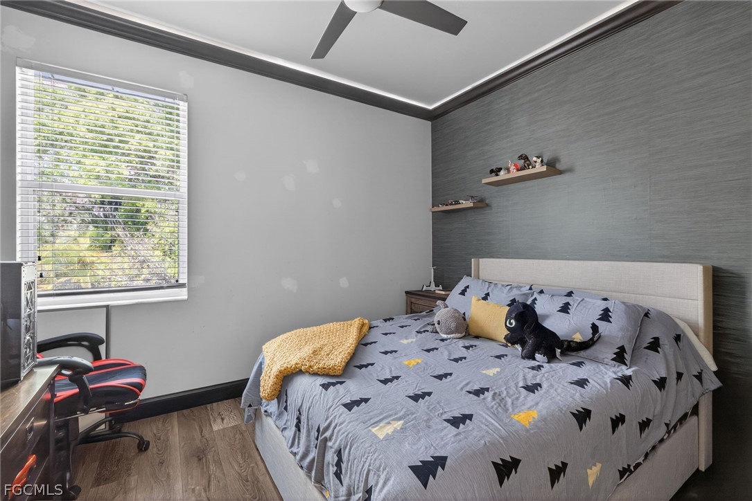 22866 Forest Ridge Drive Estero, FL 33928 - Photo 27 of 38 a bedroom with a bed and a window