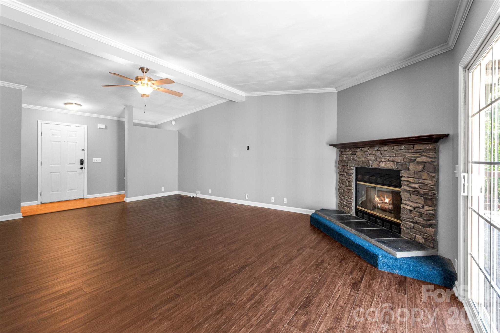434 Rutledge Drive Catawba, SC 29704 - Photo 9 of 39 an empty room with wooden floor a fireplace and window