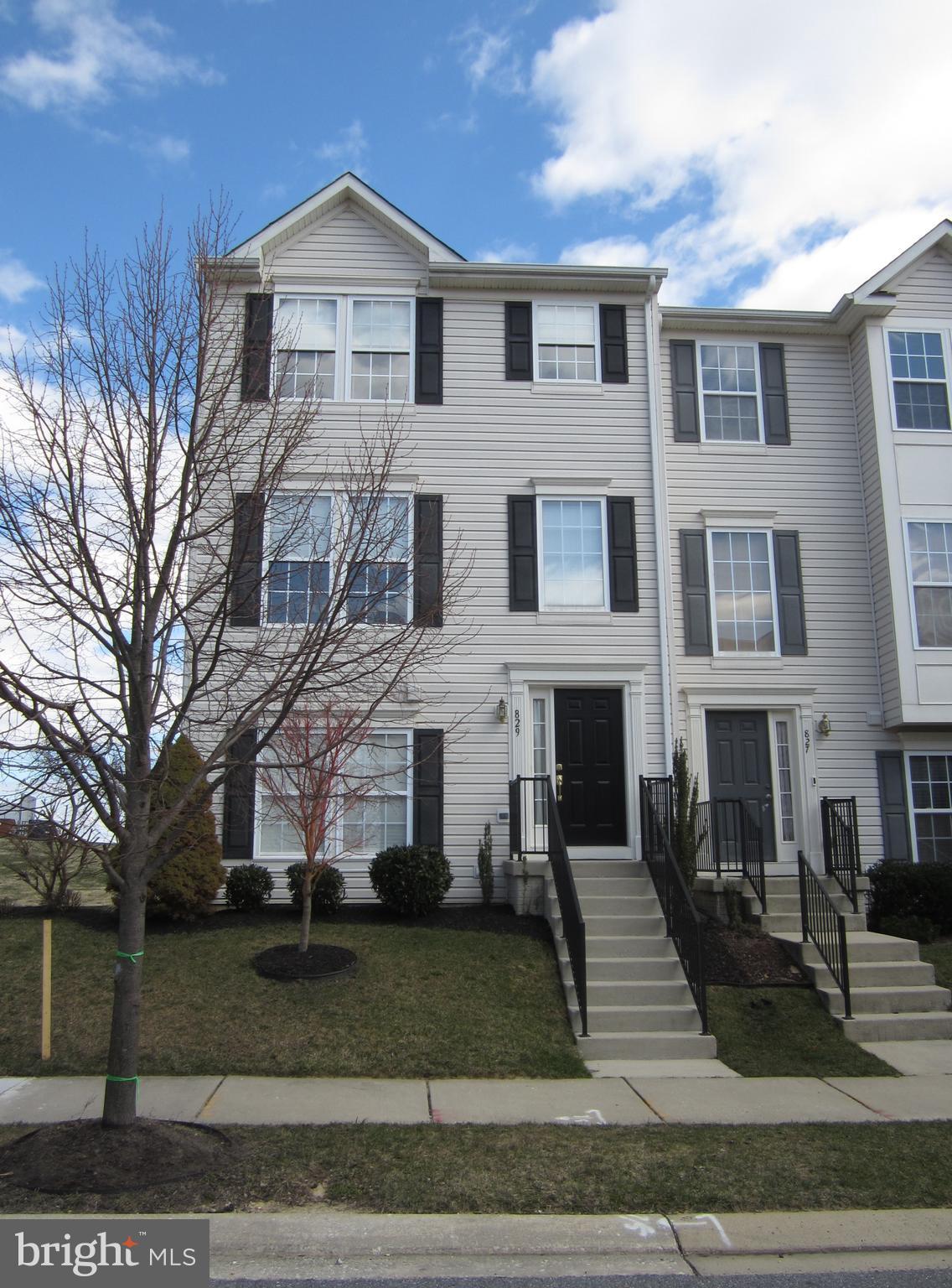 829 Lowe Road Baltimore, MD 21220 - Photo 1 of 28 a view of a white house with large windows