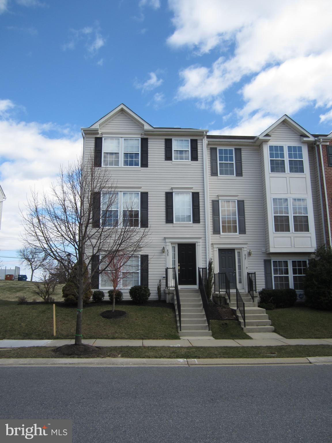 829 Lowe Road Baltimore, MD 21220 - Photo 2 of 28 a view of white house with a yard next to a road