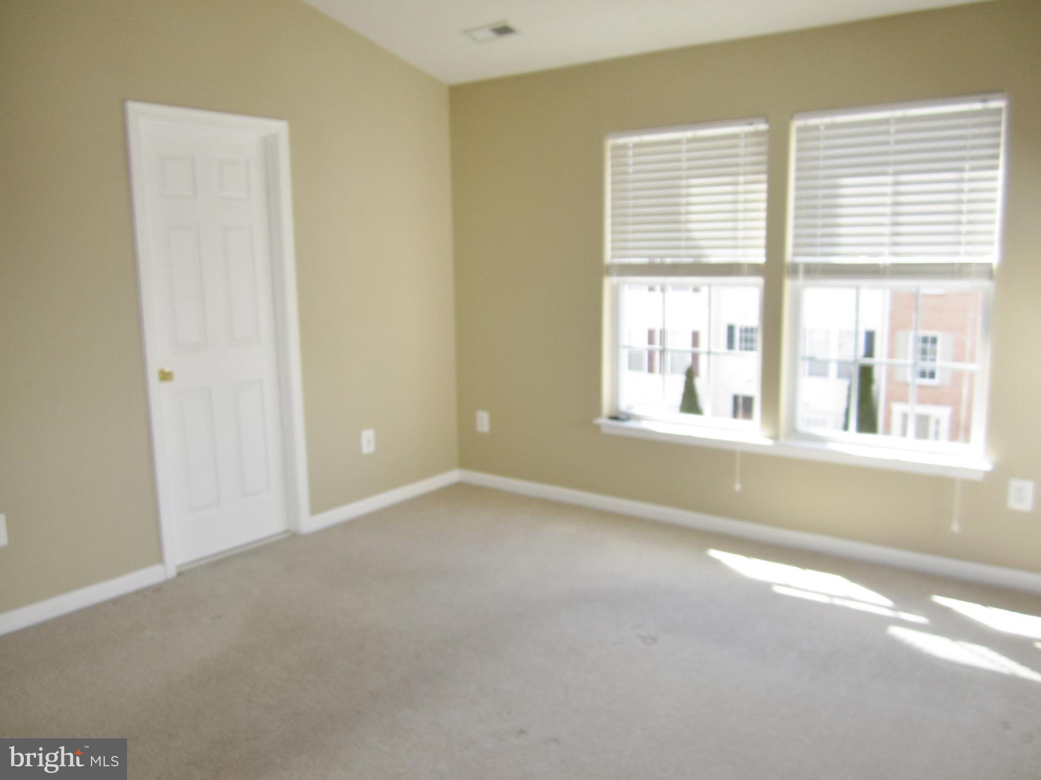 829 Lowe Road Baltimore, MD 21220 - Photo 12 of 28 a view of an empty room with a window