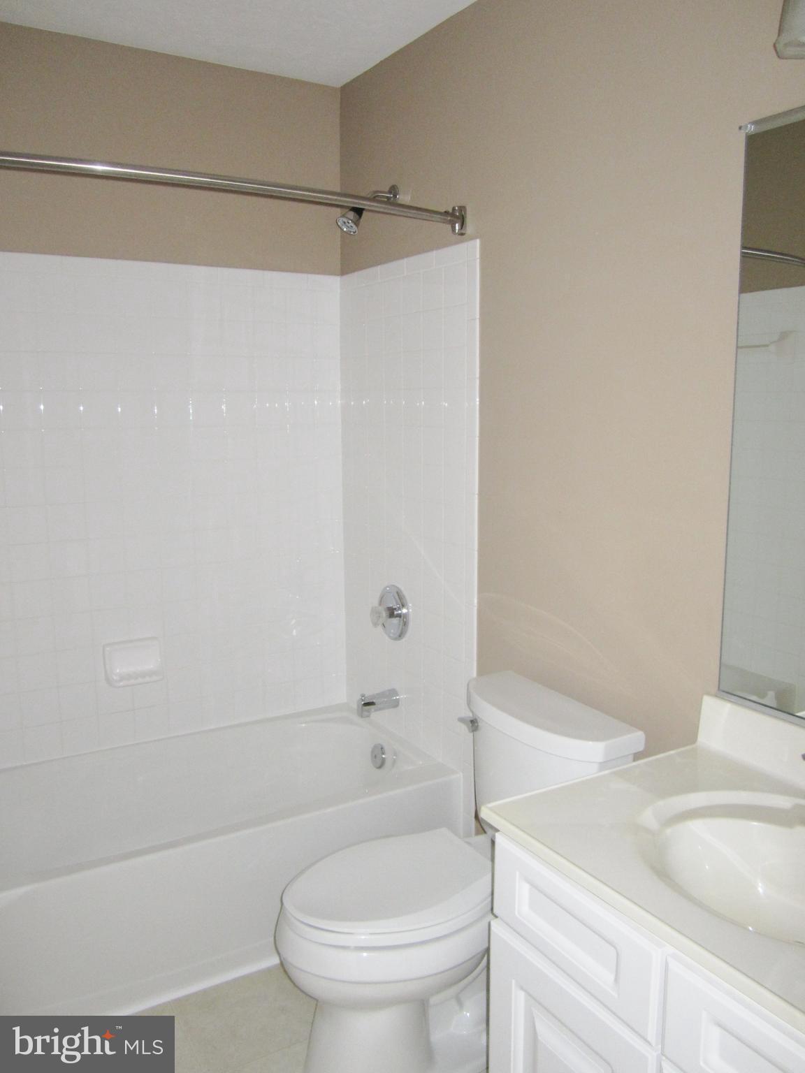 829 Lowe Road Baltimore, MD 21220 - Photo 19 of 28 a bathroom with a bathtub and a toilet