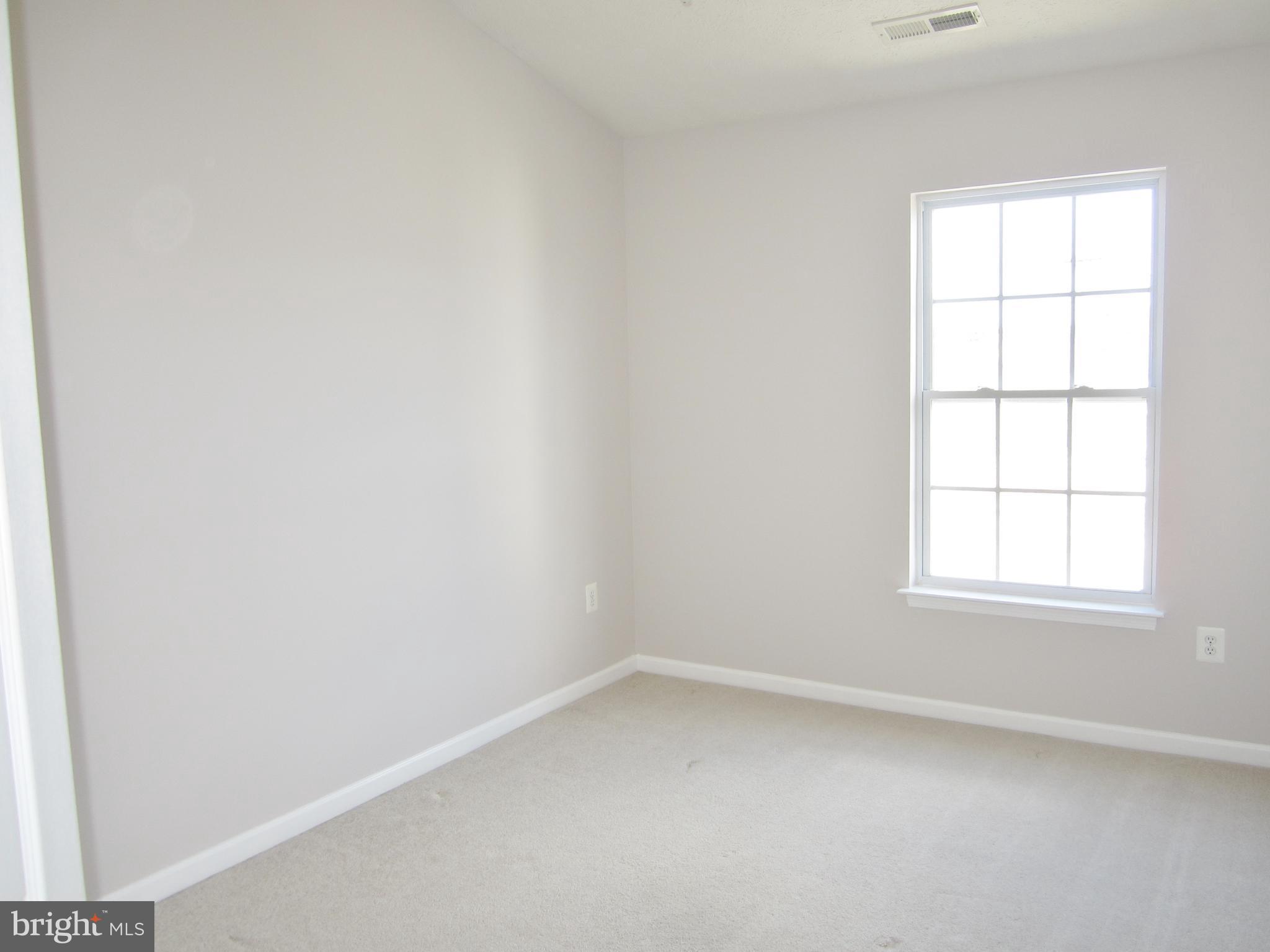829 Lowe Road Baltimore, MD 21220 - Photo 20 of 28 an empty room with a window