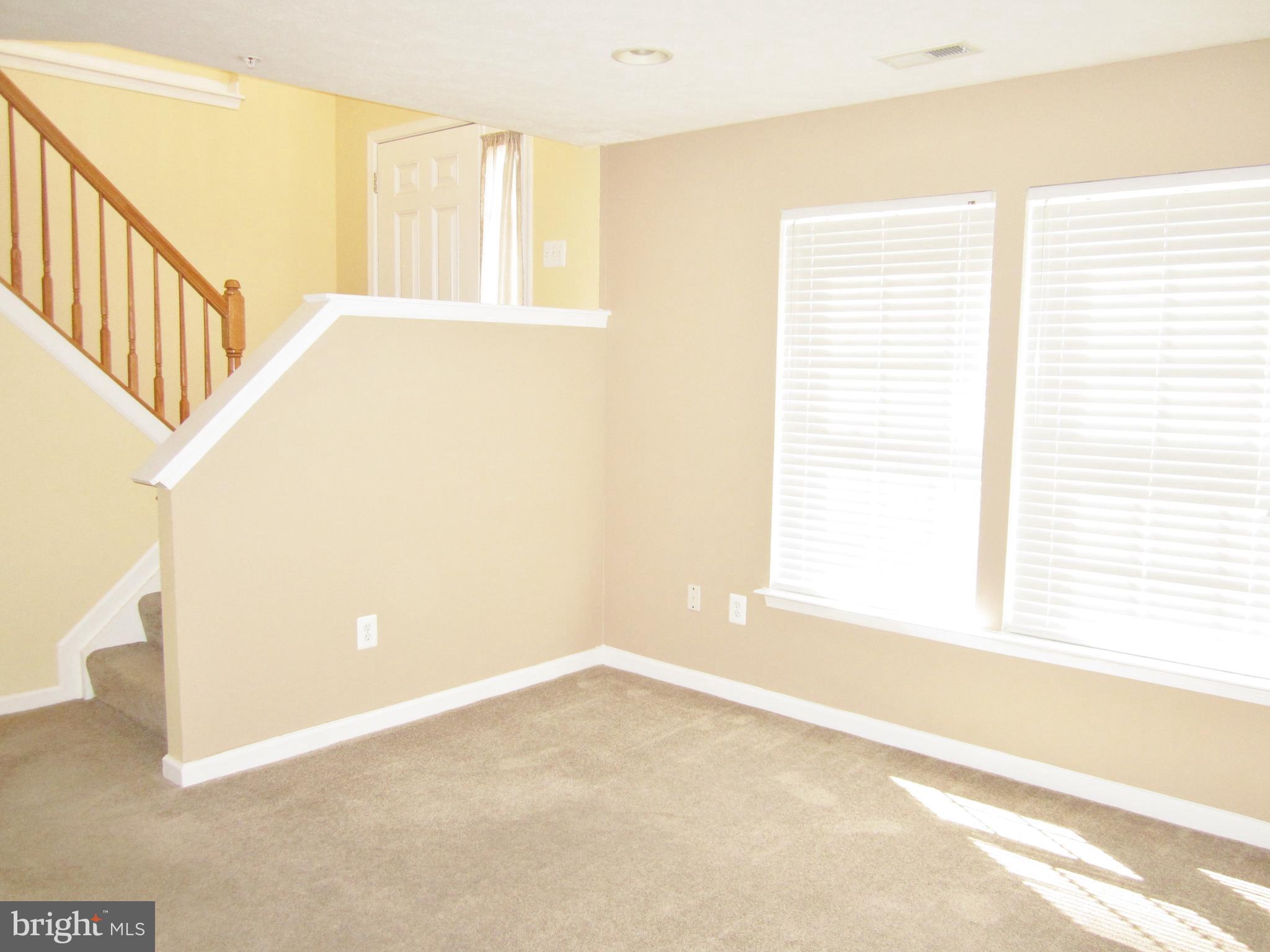 829 Lowe Road Baltimore, MD 21220 - Photo 22 of 28 a view of an empty room with a window