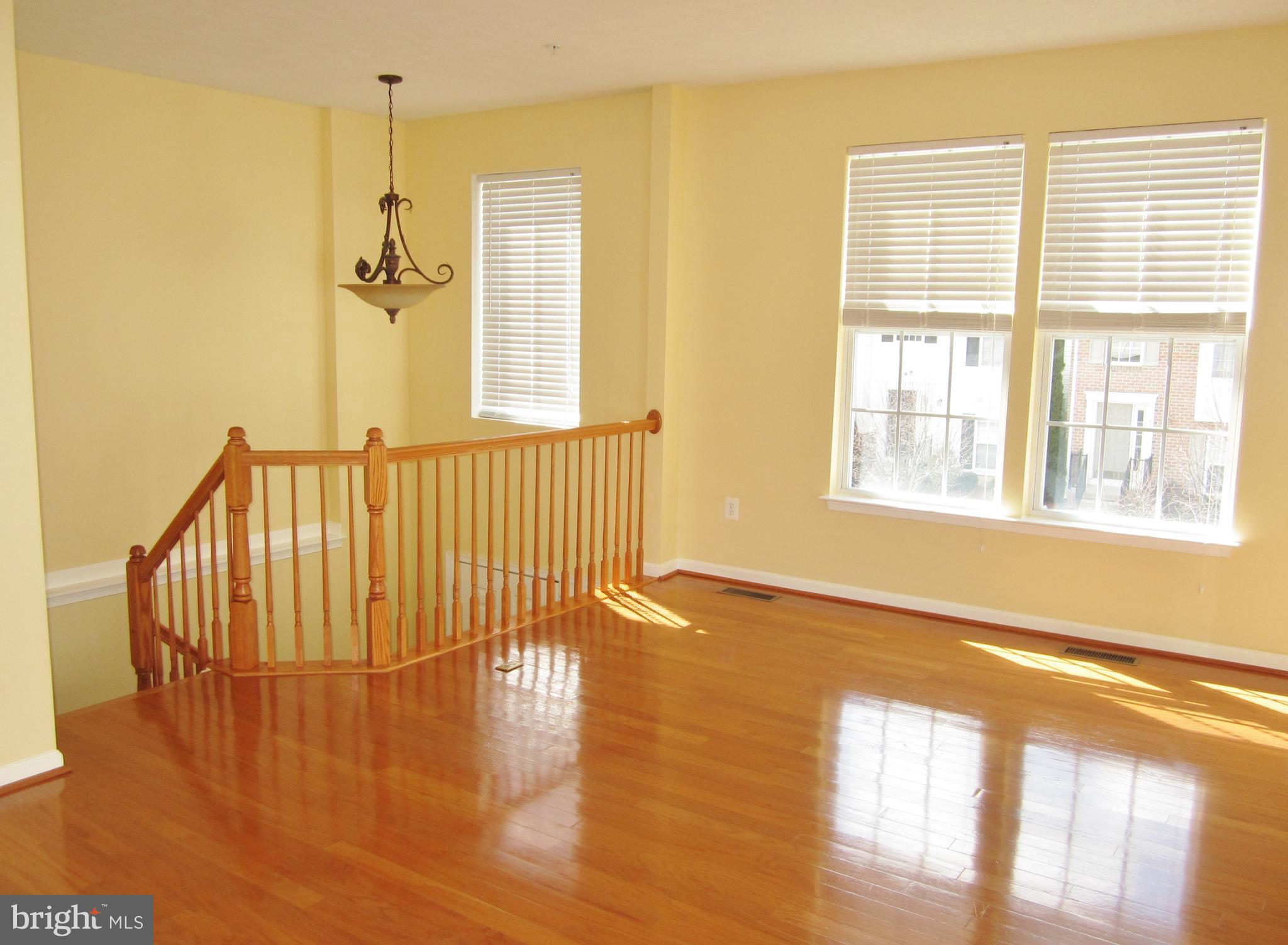 829 Lowe Road Baltimore, MD 21220 - Photo 5 of 28 a view of a room with wooden floor and windows